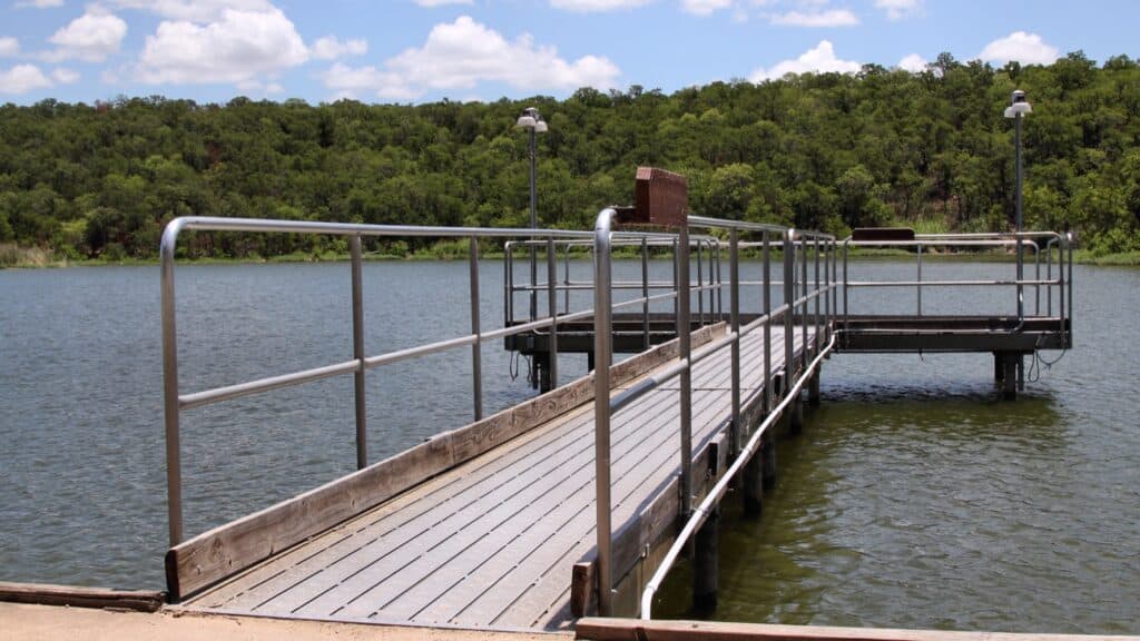 Lake Mineral Wells State Park A railed fishing pier with lamp posts reaching out over Lake Mineral Wells
