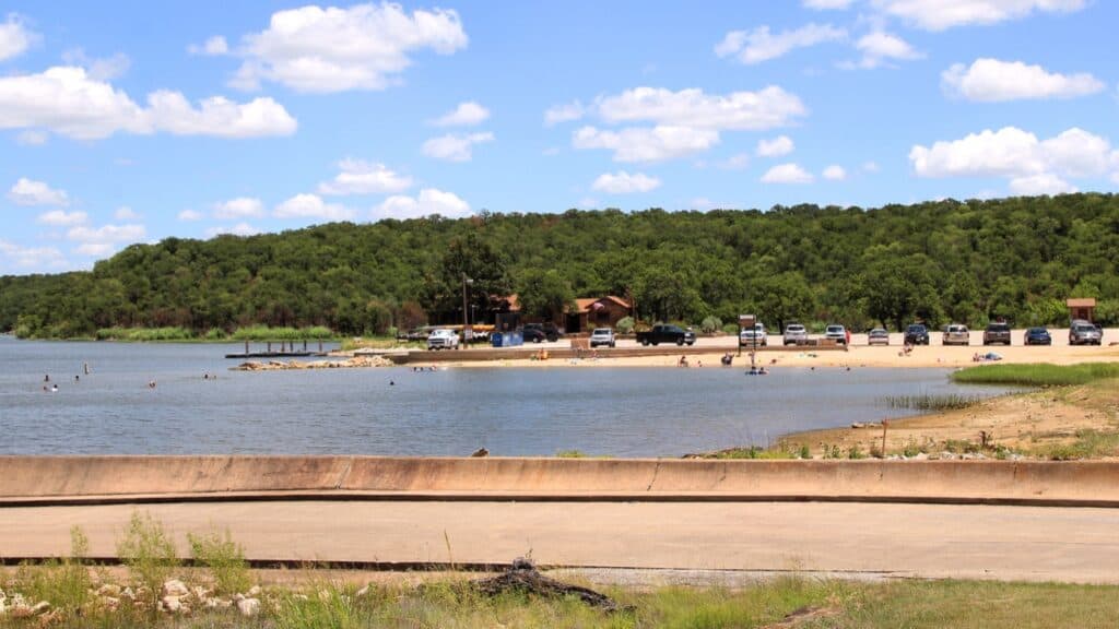 Lake Mineral Wells State Park The sandy swim beach at Lake Mineral Wells State Park, with the Park Store and parking behind it